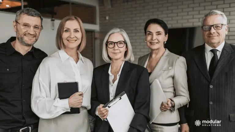 Insurance executives working together to choose a policy administration system.