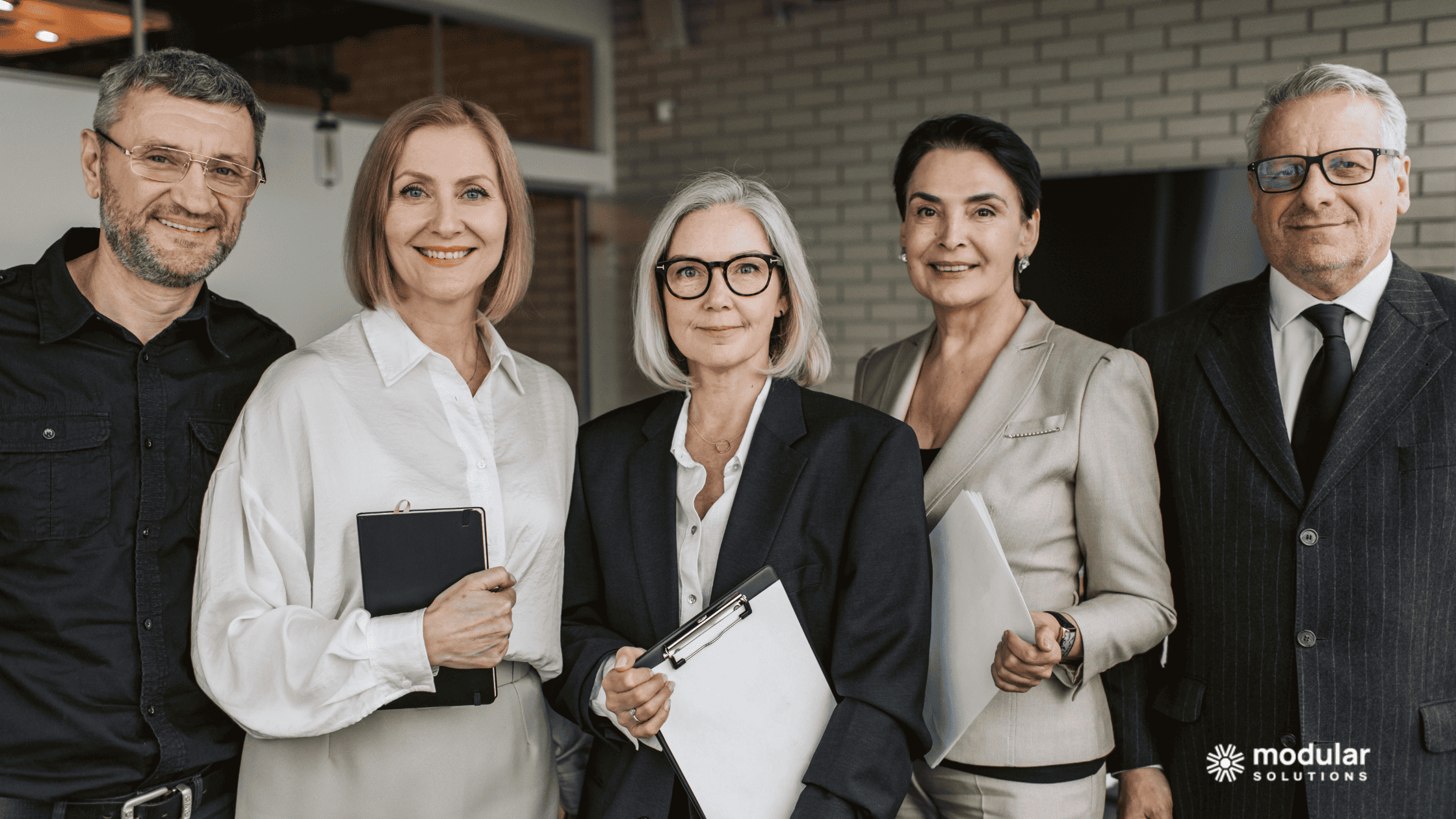 Insurance executives working together to choose a policy administration system.