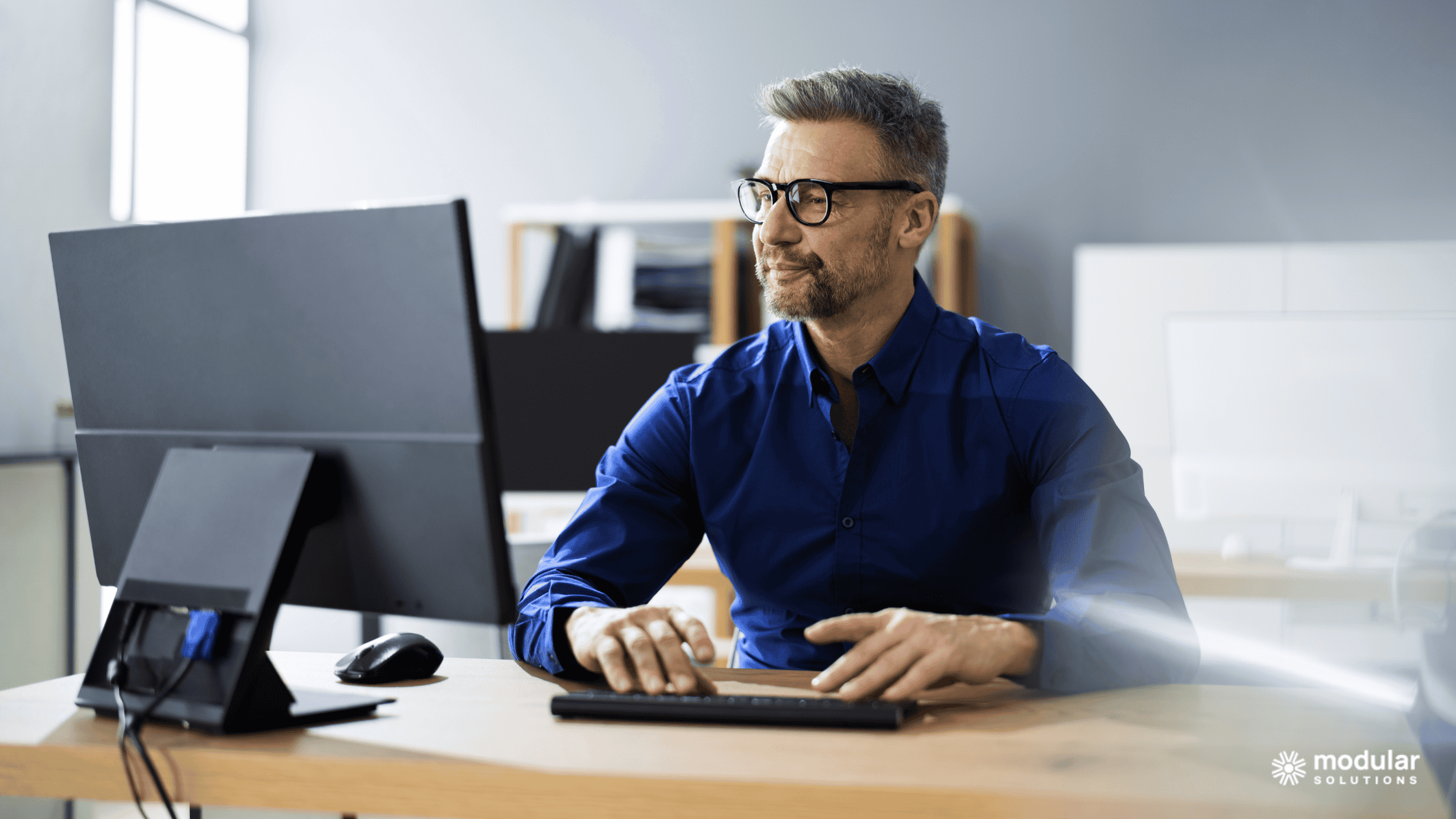 Insurance leader working on his computer.
